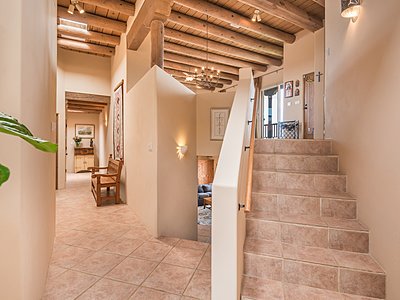 From entry foyer stairs lead up to Great Room and Kitchen 