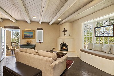 Living Room with Bay Window and Kiva Fireplace