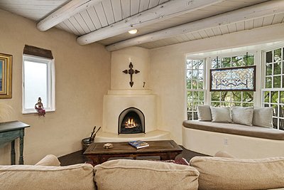 Living Room with Bay Window and Kiva Fireplace