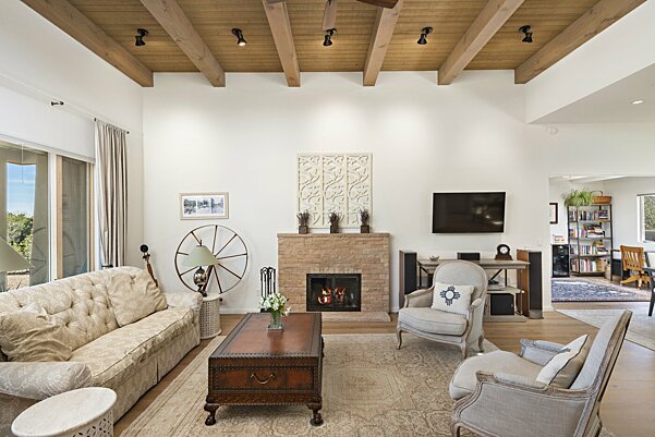 Living Room with vaulted, beamed ceilings and gas fireplace