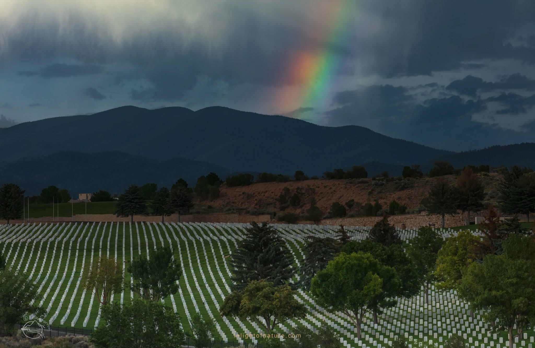 PHOTO: Rainbow fragment over the Santa Fe National Cemetery by Ed MacKerrow