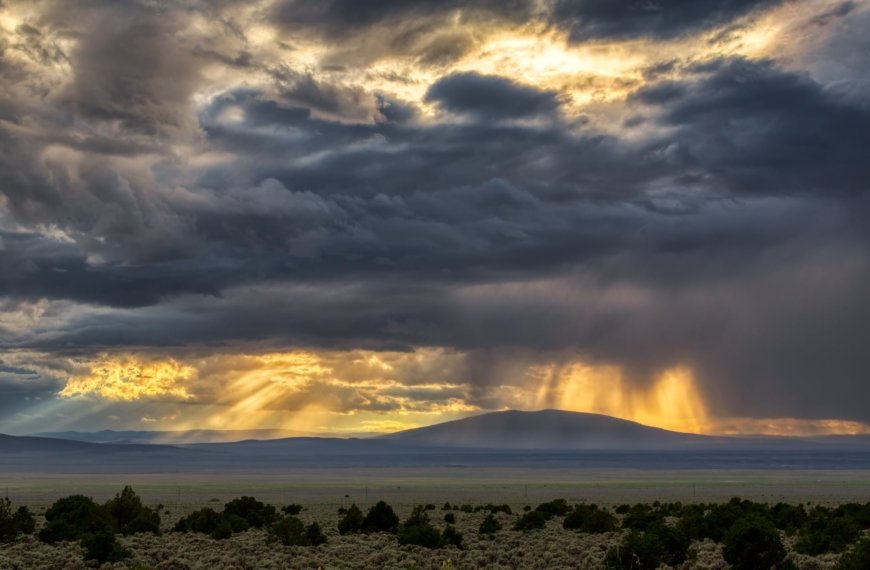 PHOTO: Storm and crepuscular rays over the Taos Plateau with Ute Mountain by Ed MacKerrow